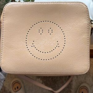 Anya Hindmarch smiley crossbody in pink patten leather